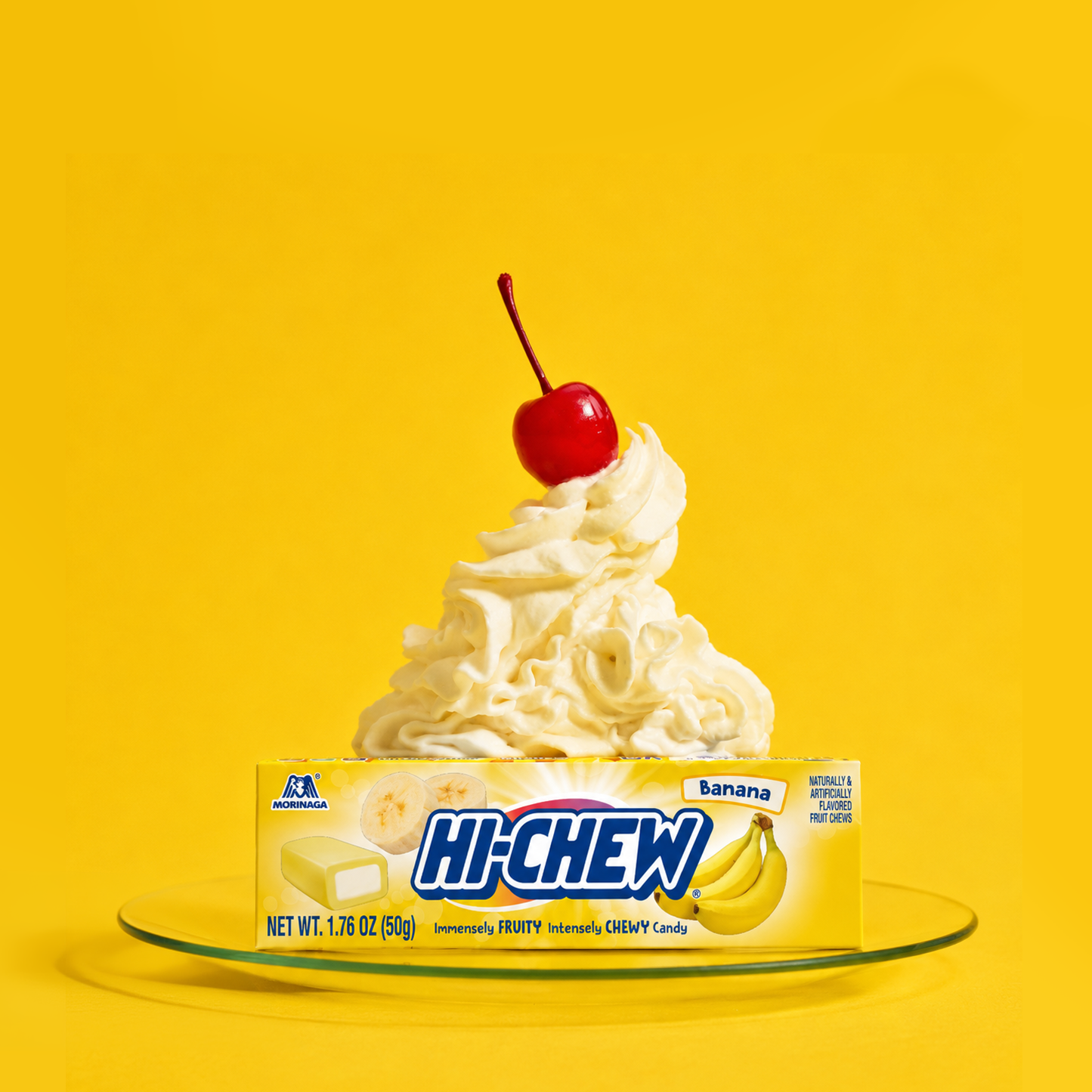 Hi-CHEW Banana Stick on a plate with whipped cream